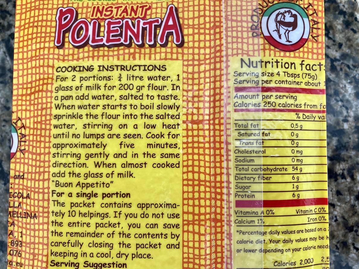 The back of a bag of polenta is shown. The cooking instructions for 2 portions involve 3/4 litre water, 1 glass of milk for 200 gr flour. For a single portion, it has instructions on storing uncooked polenta, not cooking instructions.