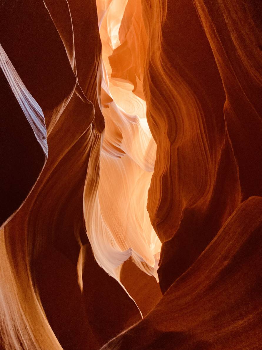 Sweeping Navajo sandstone in a contorted slot canyon.