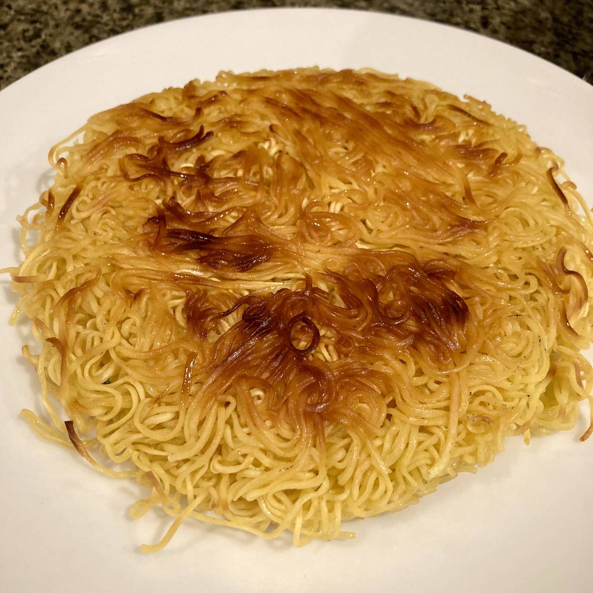 A photo of the second attempt at cooking the noodle cake.