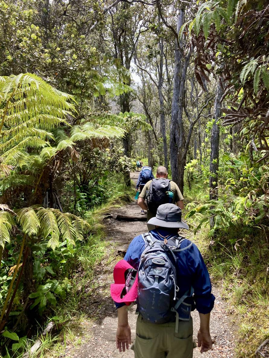 A photo of us hiking through the rain forest on the other side of the crater.