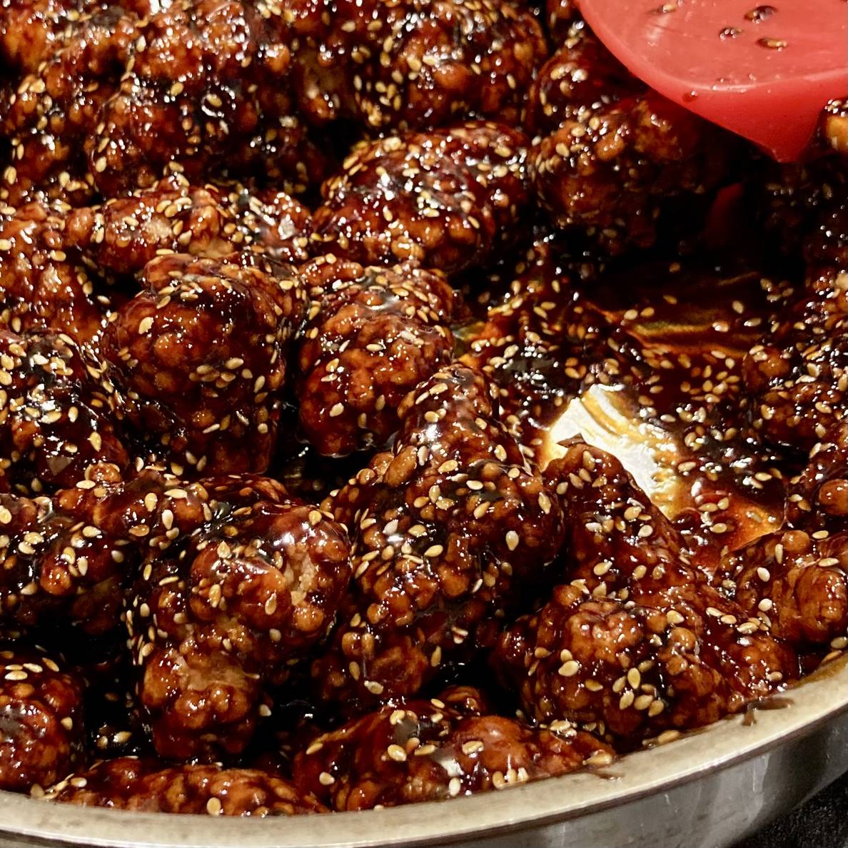 A photo of the finished sesame chicken in a pan.