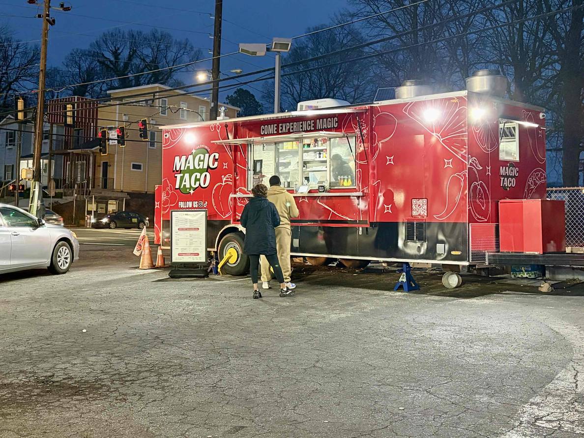 A photo of the Magic Taco food truck in a gas station parking lot.