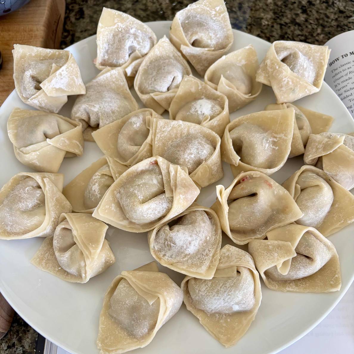 A photo of the finished wontons on a plate.